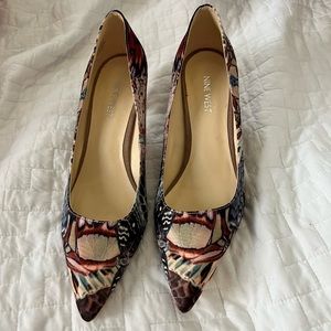 Nine West pumps. Size 8.5. Cool graffiti like print. 2” heel. Pointed toe.